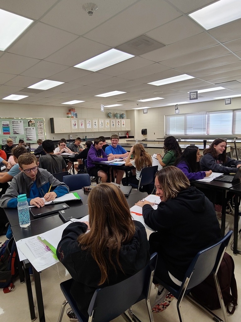 Students focus on teacher in classroom