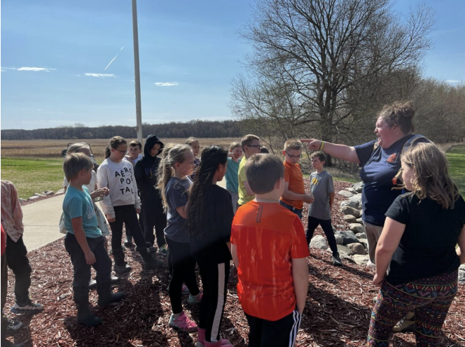 Teacher instructs students on areas of the park